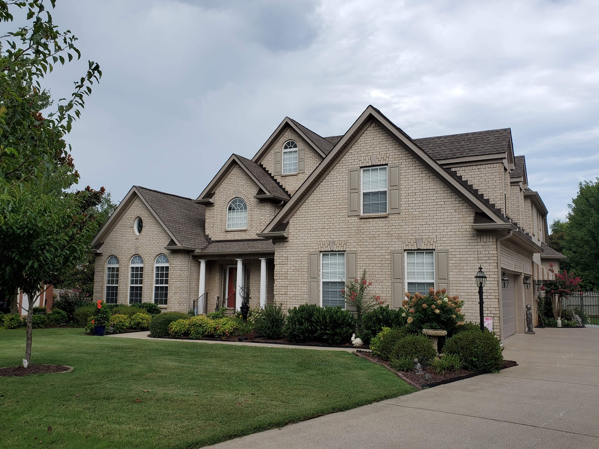 1523 Winterberry Drive Murfreesboro, TN 37130 - Photo 42 of 42 a front view of a house with a yard and garage