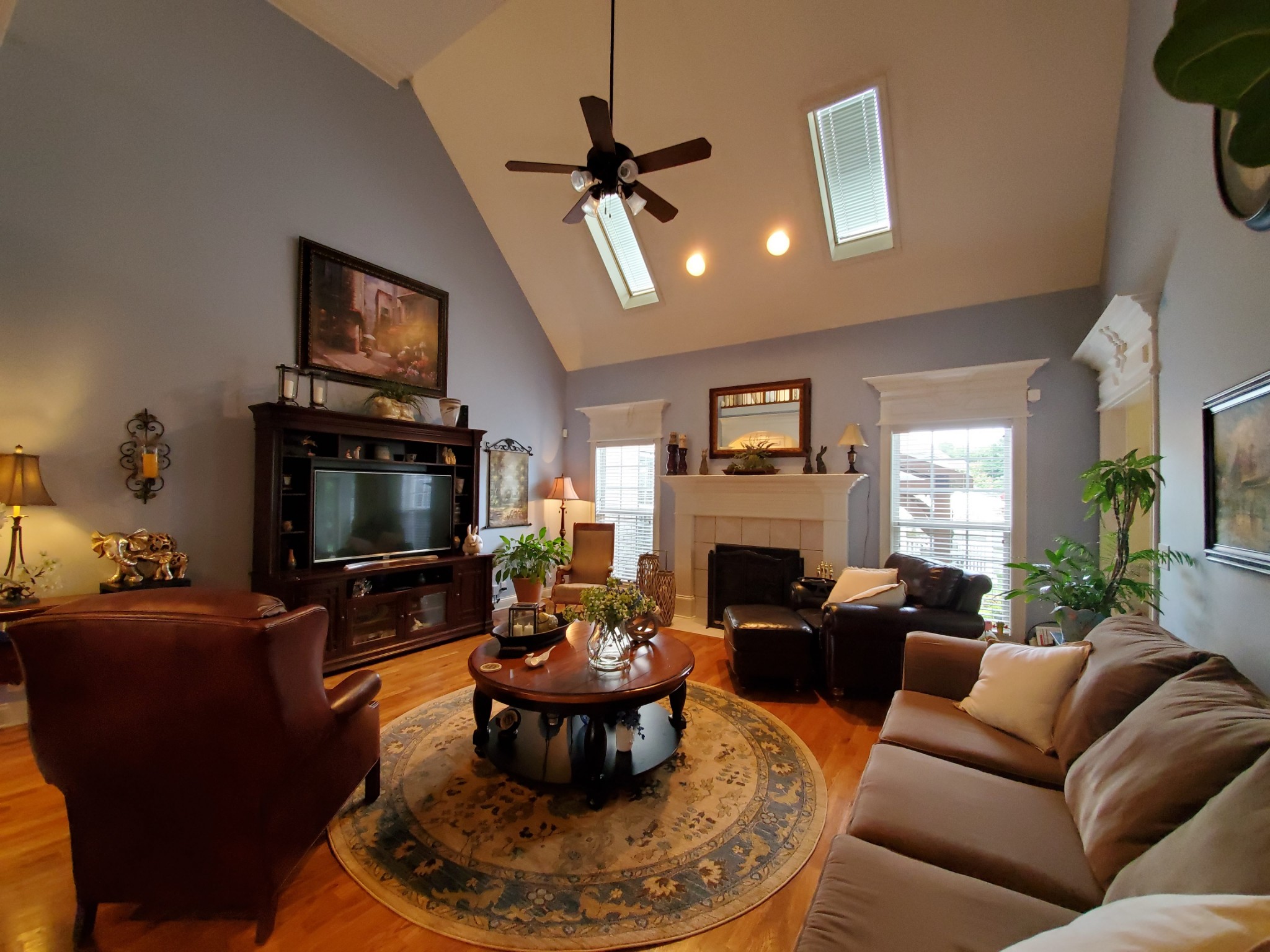 1523 Winterberry Drive Murfreesboro, TN 37130 - Photo 9 of 42 a living room with furniture a fireplace and a flat screen tv