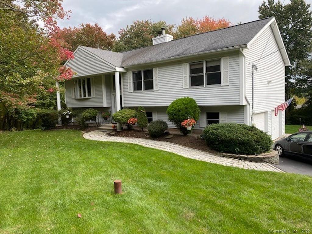 20 Beecher Road Wolcott, CT 06716 - Photo 1 of 1 a front view of a house with garden