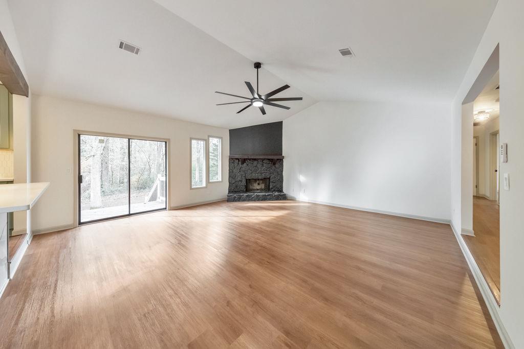 1535 Rucker Road Alpharetta, GA 30009 - Photo 12 of 42 a view of an empty room with a window and wooden floor