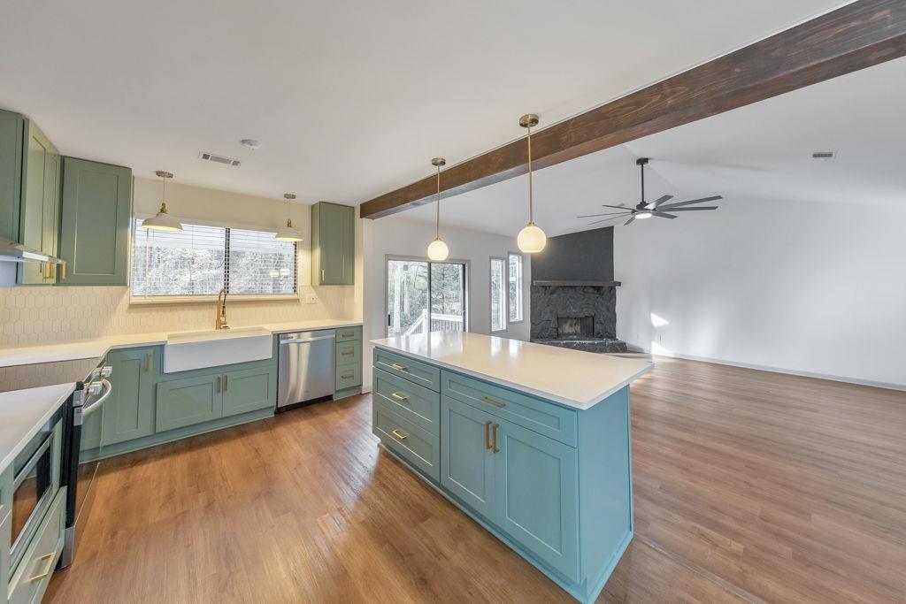 1535 Rucker Road Alpharetta, GA 30009 - Photo 13 of 42 a large kitchen with a wooden floor and a large window