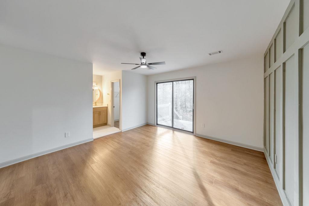 1535 Rucker Road Alpharetta, GA 30009 - Photo 22 of 42 a view of an empty room with a window and wooden floor