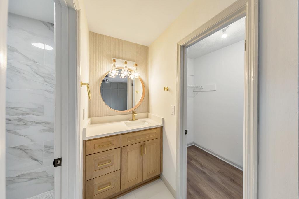 1535 Rucker Road Alpharetta, GA 30009 - Photo 24 of 42 a en suite bathroom with a sink and mirror