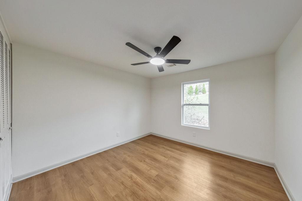 1535 Rucker Road Alpharetta, GA 30009 - Photo 31 of 42 an empty room with window and ceiling fan