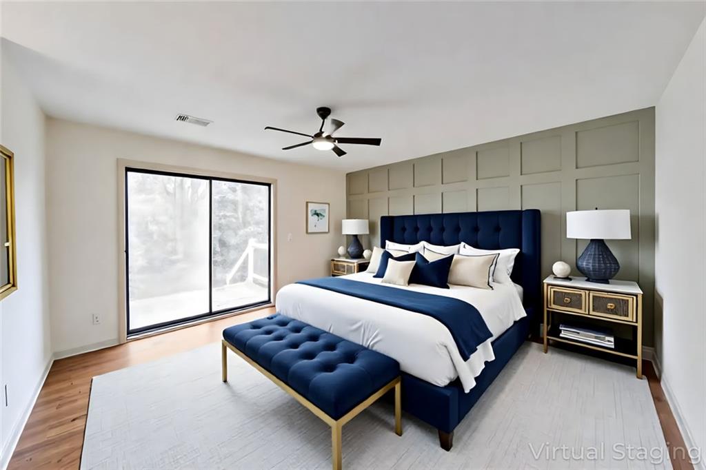 1535 Rucker Road Alpharetta, GA 30009 - Photo 5 of 42 a spacious bedroom with a bed and a window