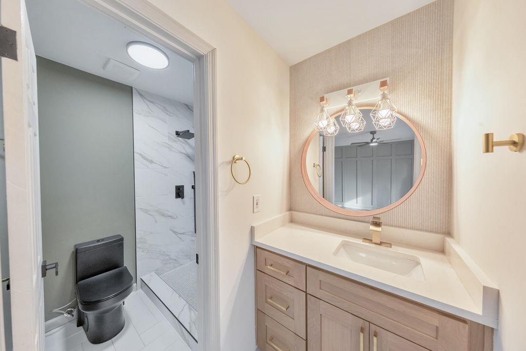 1535 Rucker Road Alpharetta, GA 30009 - Photo 6 of 42 a bathroom with a double vanity sink mirror and toilet
