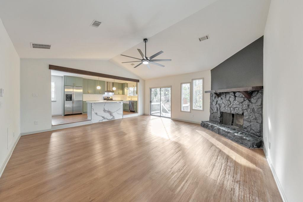 1535 Rucker Road Alpharetta, GA 30009 - Photo 10 of 42 a view of an empty room with a fireplace and a window