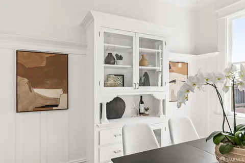 a dining room with furniture and window