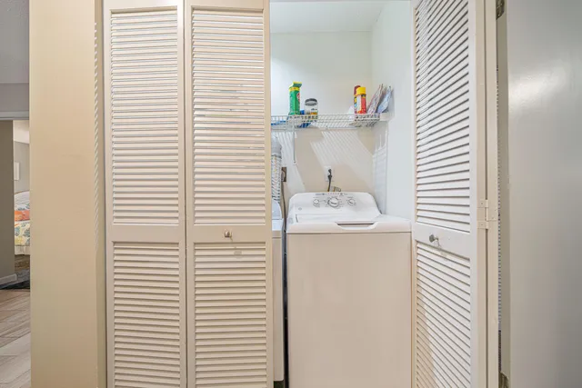 a bathroom view with a sink and a chair