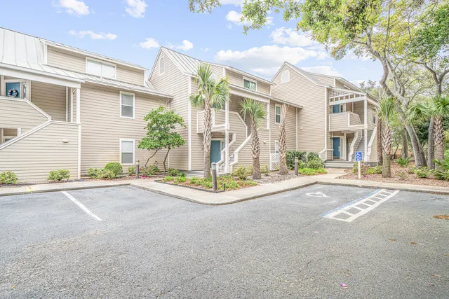an aerial view of a house with a swimming pool and garden