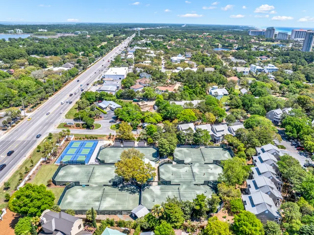 an aerial view of a city with lawn chairs