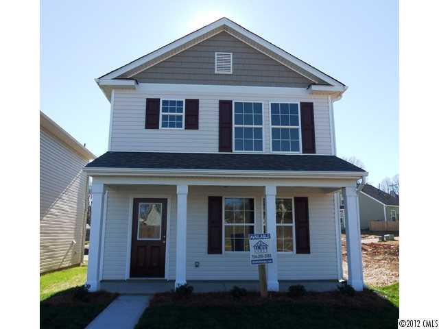 12429 Stumptown Road, Unit 4 Huntersville, NC 28078 - Photo 1 of 16 a front view of a house with a yard