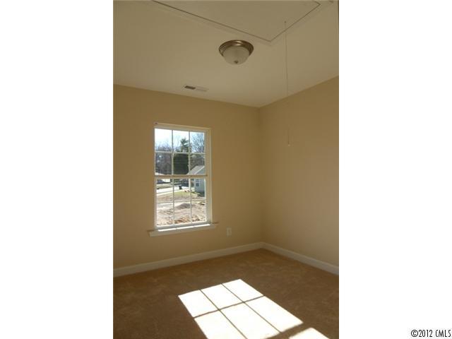 12429 Stumptown Road, Unit 4 Huntersville, NC 28078 - Photo 11 of 16 a picture of a bathroom with a sink and a window