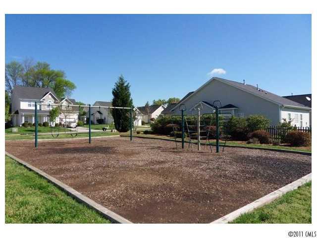 12429 Stumptown Road, Unit 4 Huntersville, NC 28078 - Photo 15 of 16 a house view with a garden space