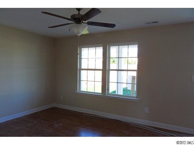 12429 Stumptown Road, Unit 4 Huntersville, NC 28078 - Photo 3 of 16 a view of an empty room with a window