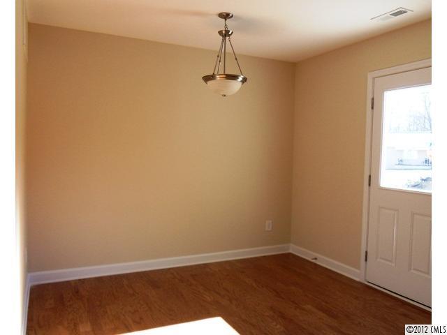 12429 Stumptown Road, Unit 4 Huntersville, NC 28078 - Photo 5 of 16 an empty room with windows