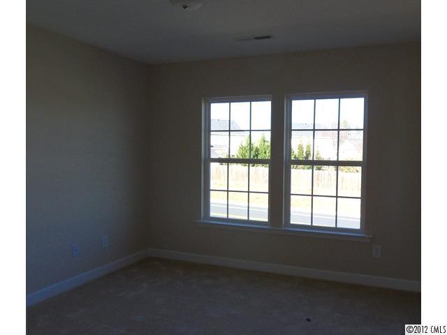 12429 Stumptown Road, Unit 4 Huntersville, NC 28078 - Photo 7 of 16 an empty room with a window