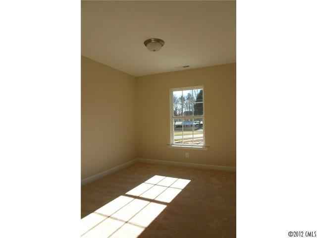12429 Stumptown Road, Unit 4 Huntersville, NC 28078 - Photo 9 of 16 a picture of a room with a window and a ceiling fan