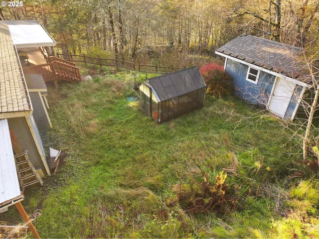 a view of balcony with wooden floor and yard