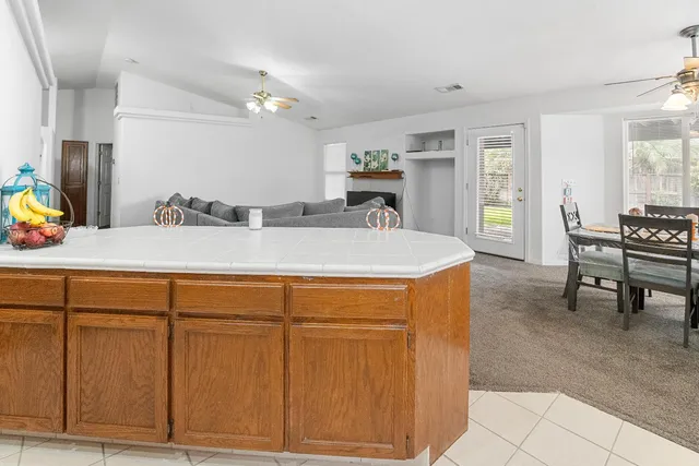 a view of living room with granite countertop furniture and a dresser