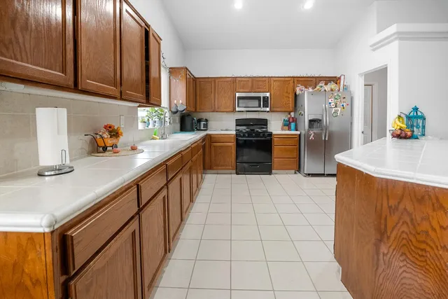 an empty room with kitchen