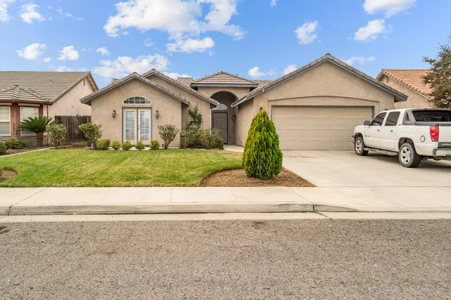 a view of a house with a street
