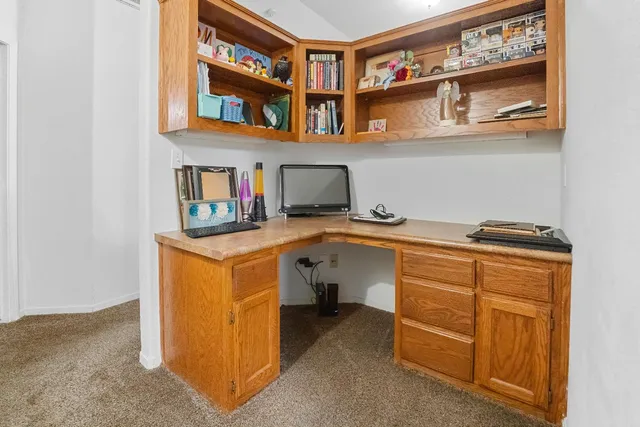 a view of a hallway with seating space