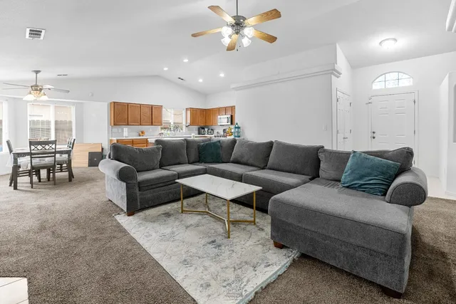 a living room with furniture and a couch