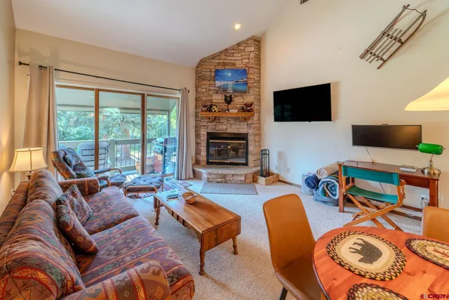 an aerial view of a house with outdoor space and a mountain view