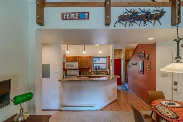 a view of a house with roof deck and seating space