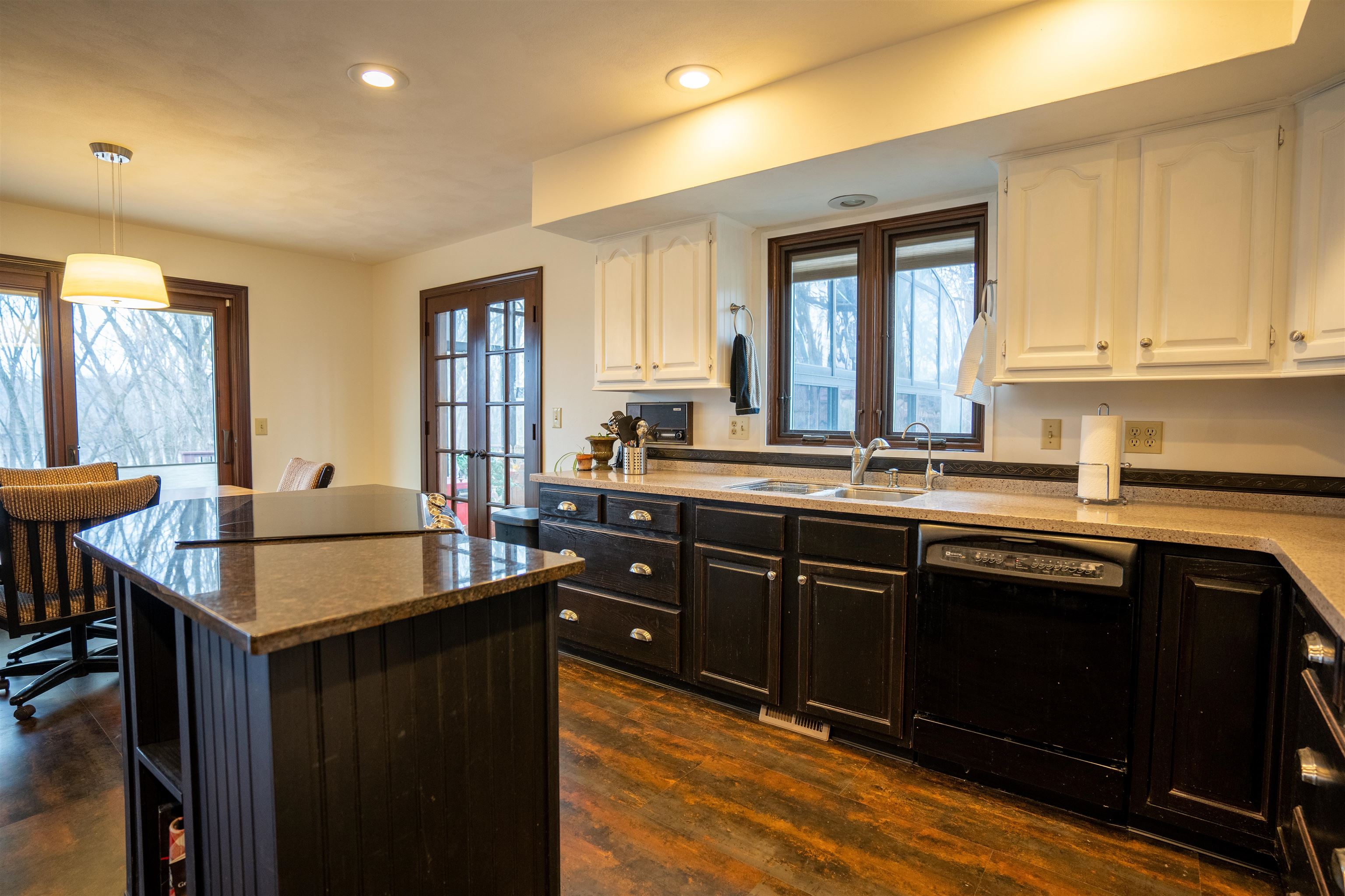 11662 Bend River Road Roscoe, IL 61073 - Photo 12 of 61 a kitchen with granite countertop a sink cabinets and window