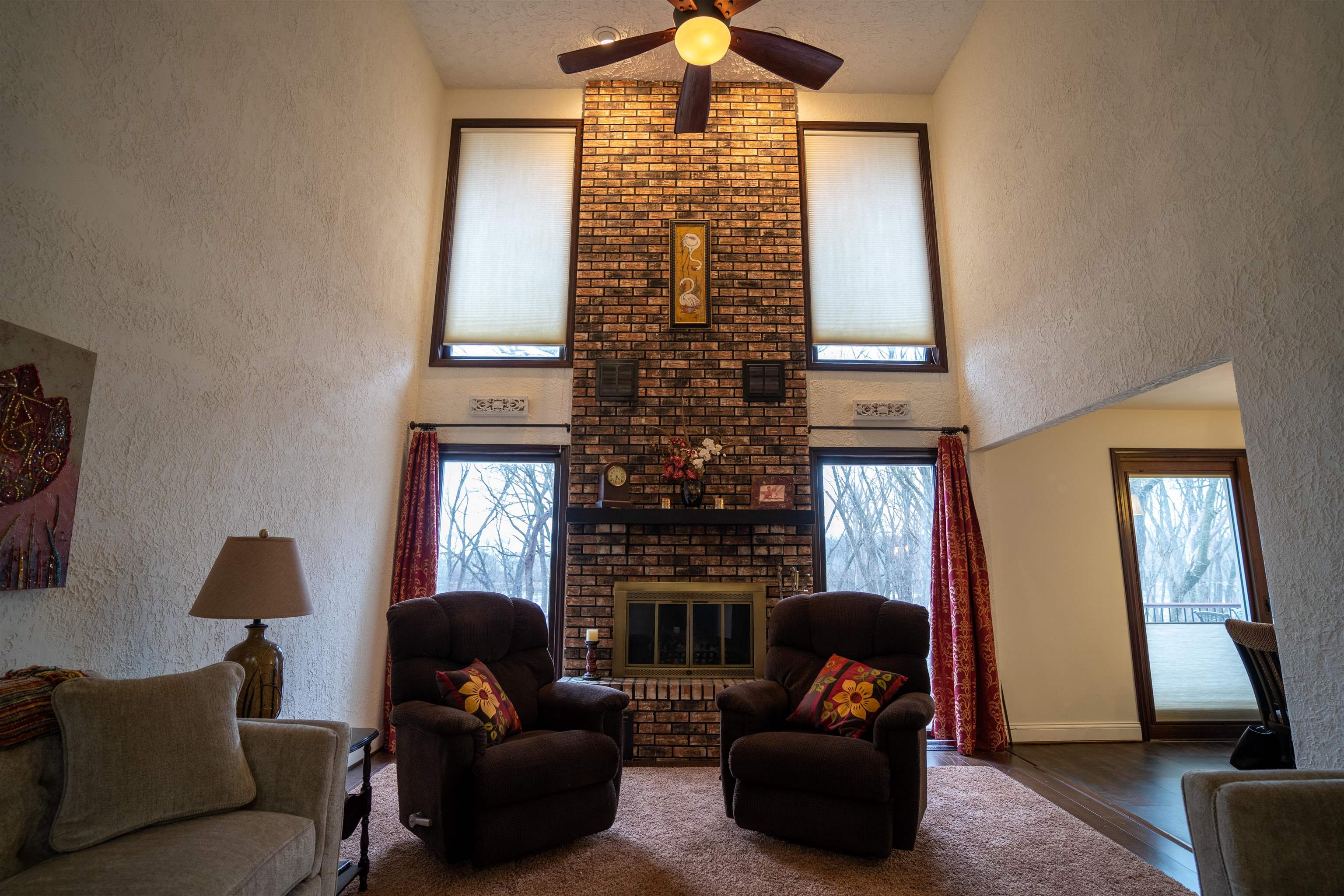 11662 Bend River Road Roscoe, IL 61073 - Photo 17 of 61 a living room with furniture windows and a fireplace