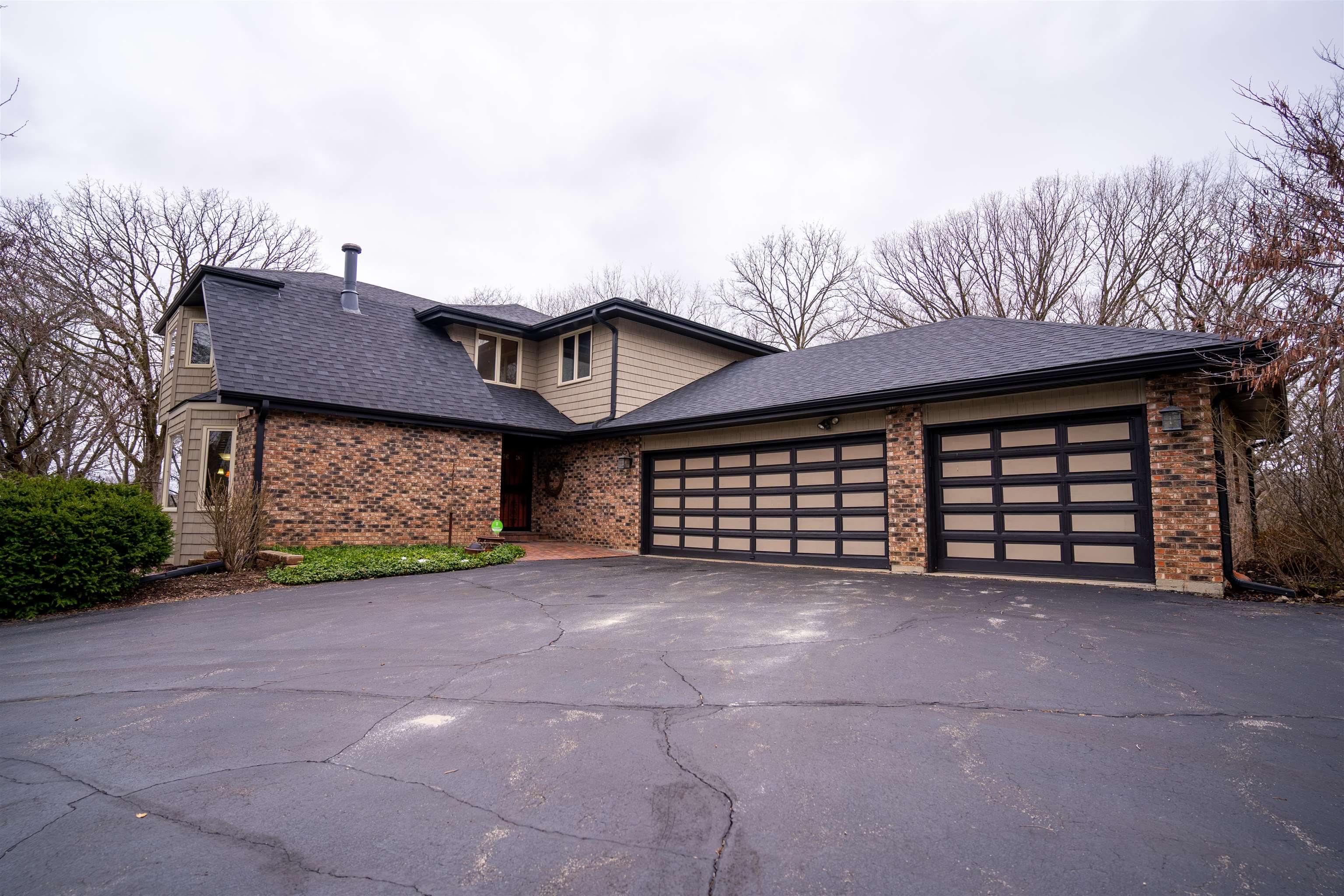 11662 Bend River Road Roscoe, IL 61073 - Photo 2 of 61 a view of a house with a yard and garage