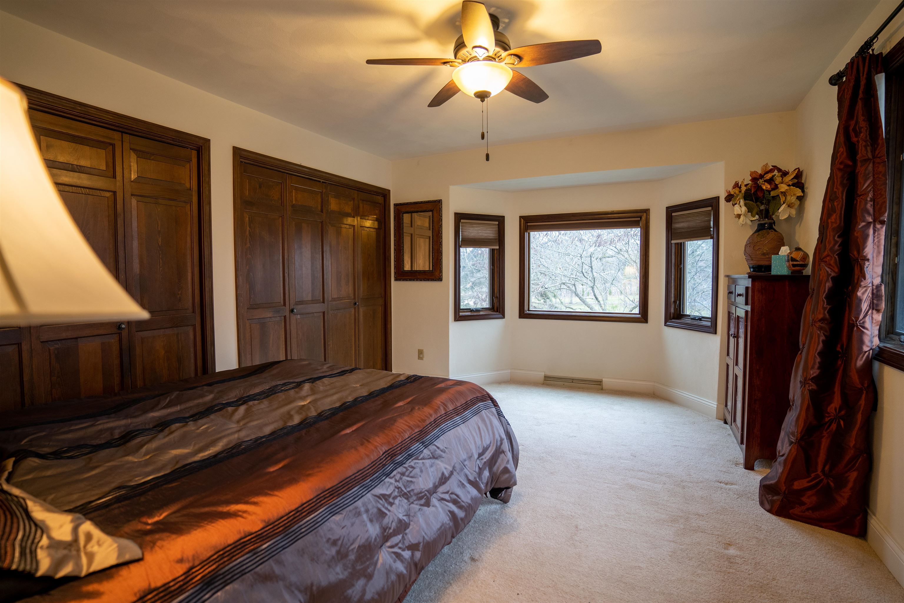 11662 Bend River Road Roscoe, IL 61073 - Photo 22 of 61 a bedroom with a bed closet and a window