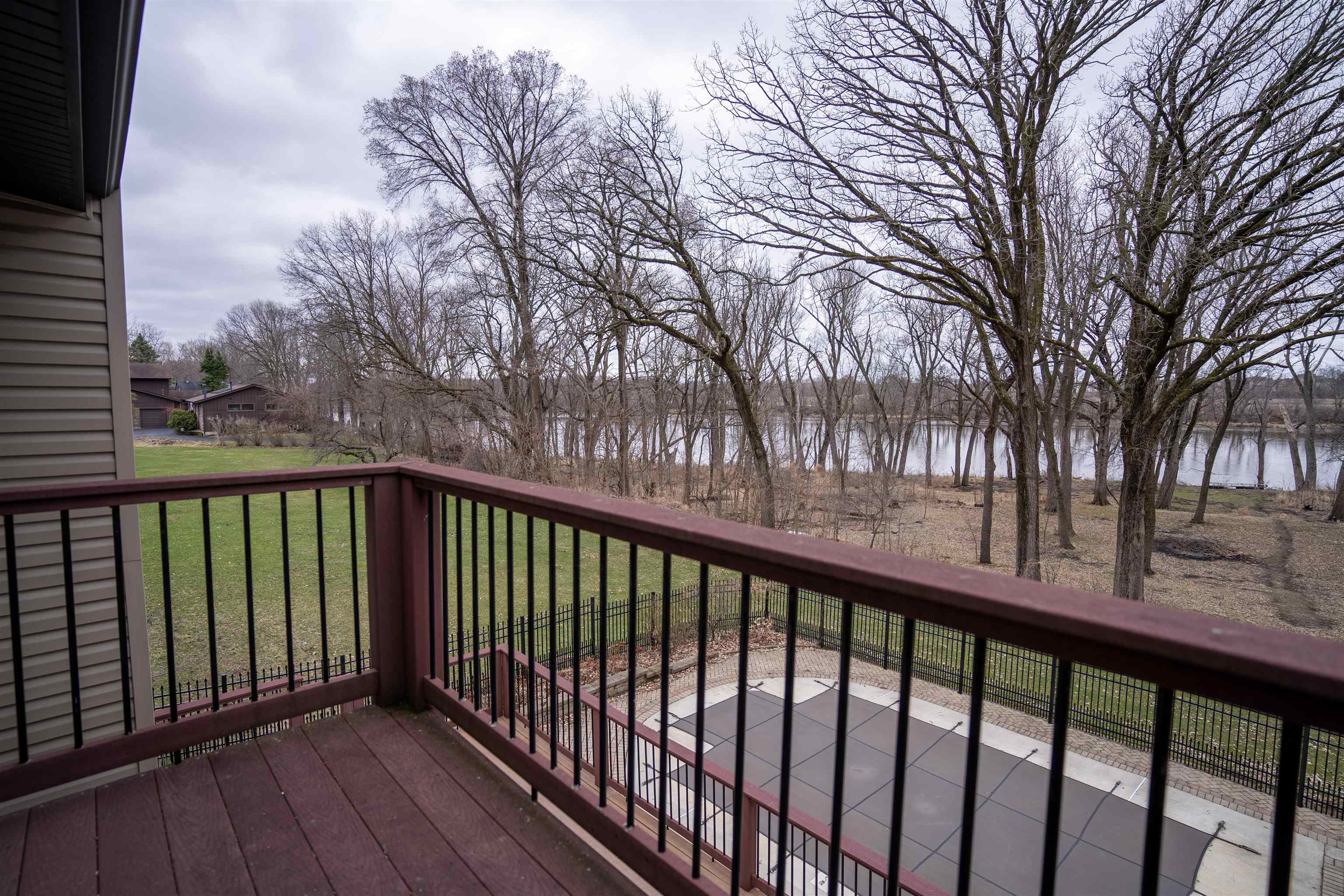 11662 Bend River Road Roscoe, IL 61073 - Photo 29 of 61 a view of a balcony with trees