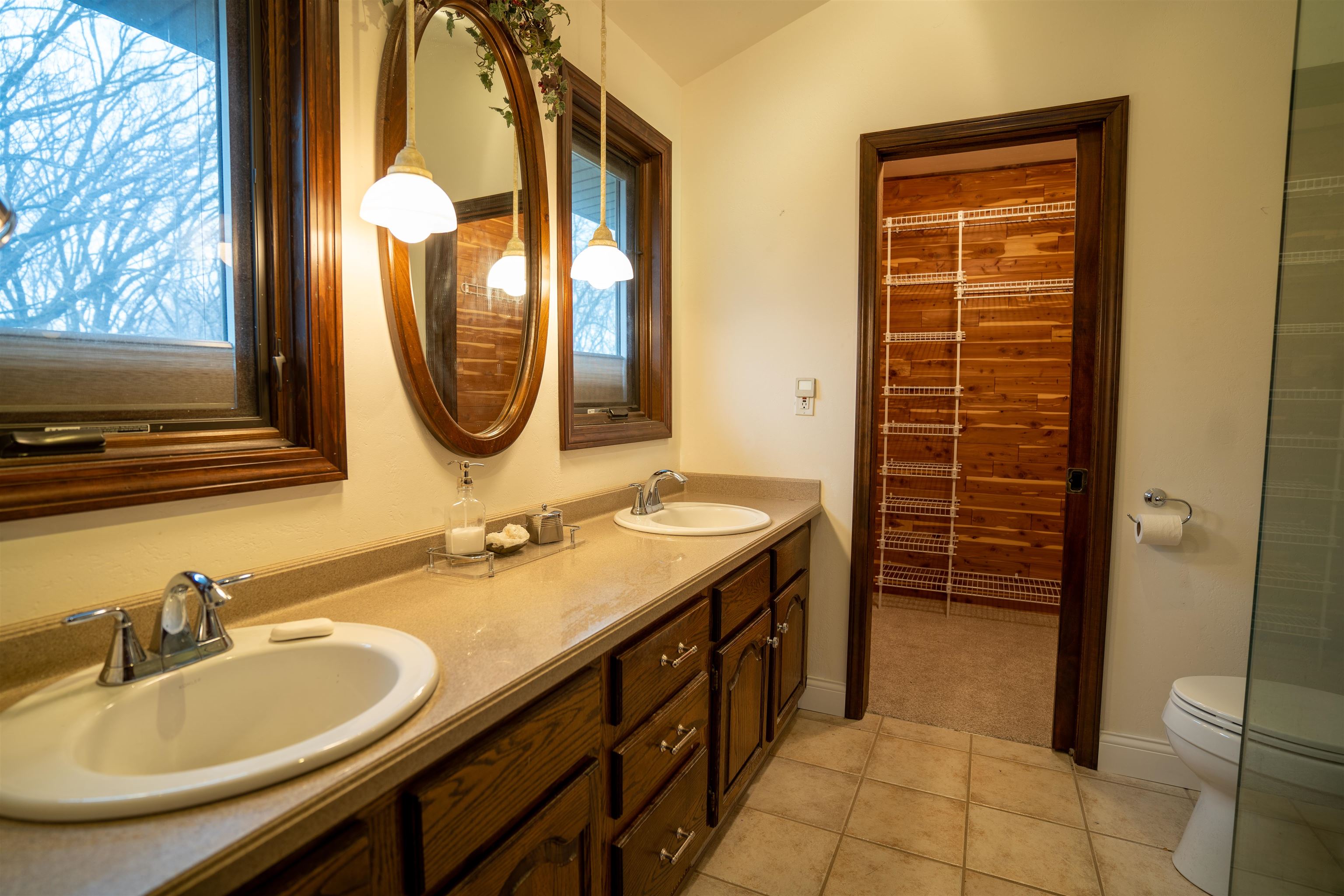 11662 Bend River Road Roscoe, IL 61073 - Photo 31 of 61 a bathroom with a double vanity sink and a mirror