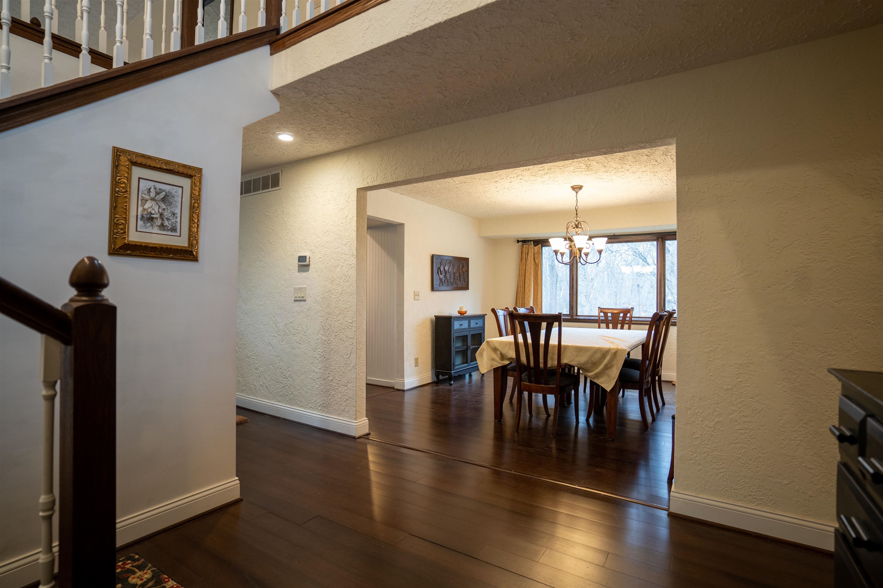 11662 Bend River Road Roscoe, IL 61073 - Photo 4 of 61 a view of a dining room with furniture and wooden floor