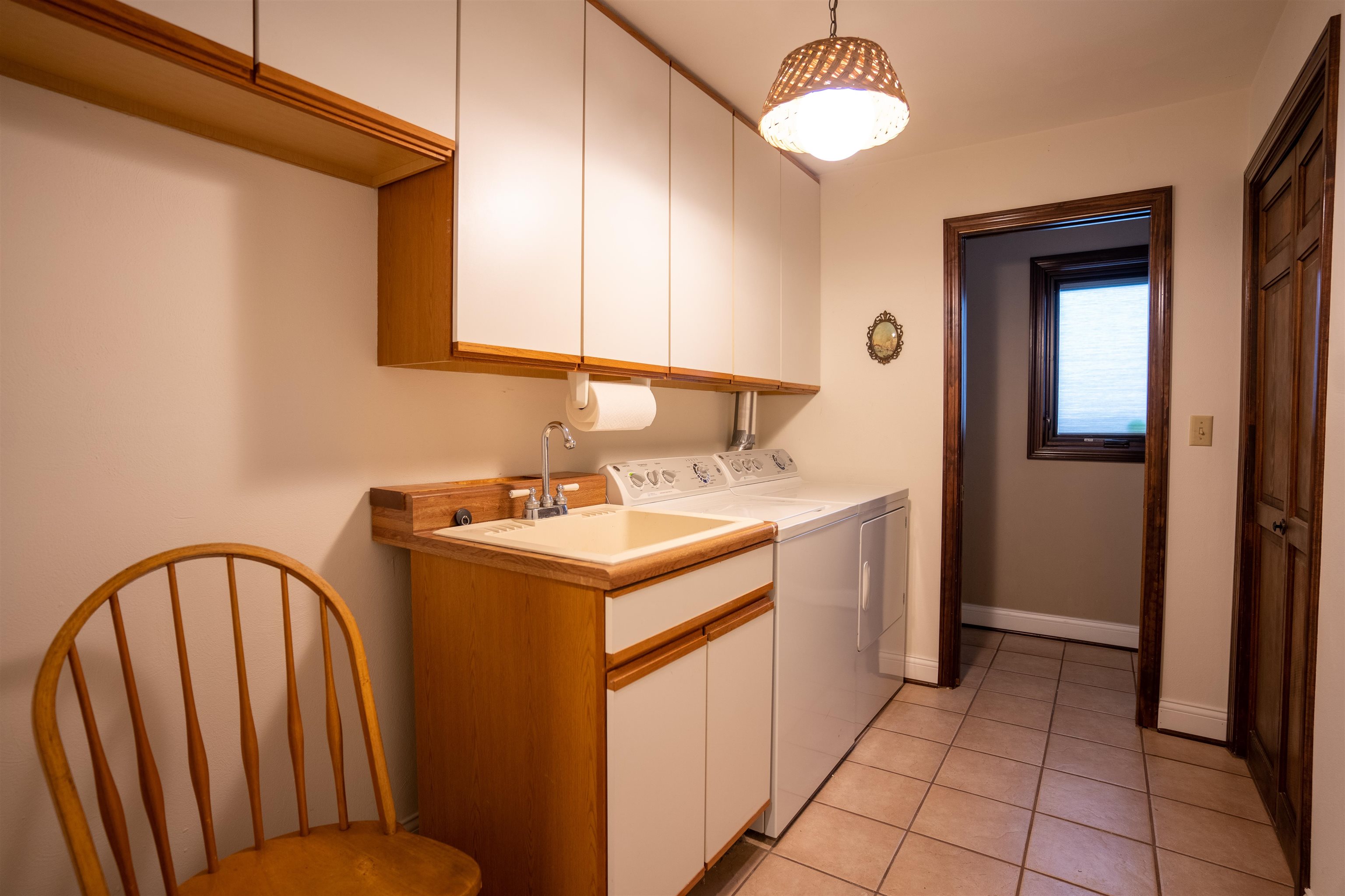 11662 Bend River Road Roscoe, IL 61073 - Photo 5 of 61 a utility room with cabinets washer and dryer