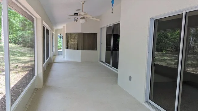 a view of a hallway with windows