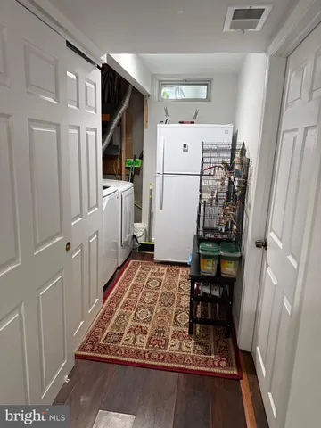 a room with furniture and white walls