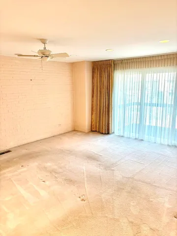 a view of a room with a refrigerator