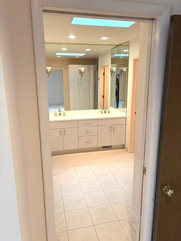 a bathroom with a glass shower door