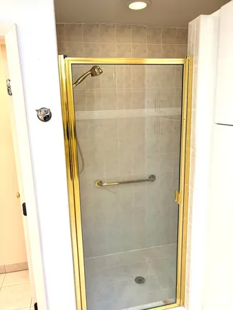 a view of a room with a window and wooden floor