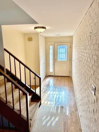 a view of entryway with wooden floor