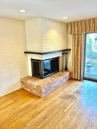 a view of an empty room with furniture