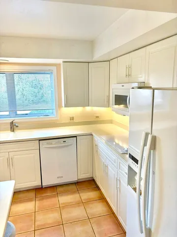 an empty room with a empty space and a sink