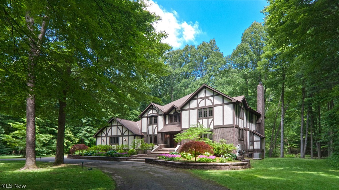 9760 Smith Road Willoughby, OH 44094 - Photo 1 of 30 Serenely set on this private 14 acre parcel sits this 1990 built tudor home in Waite Hill!