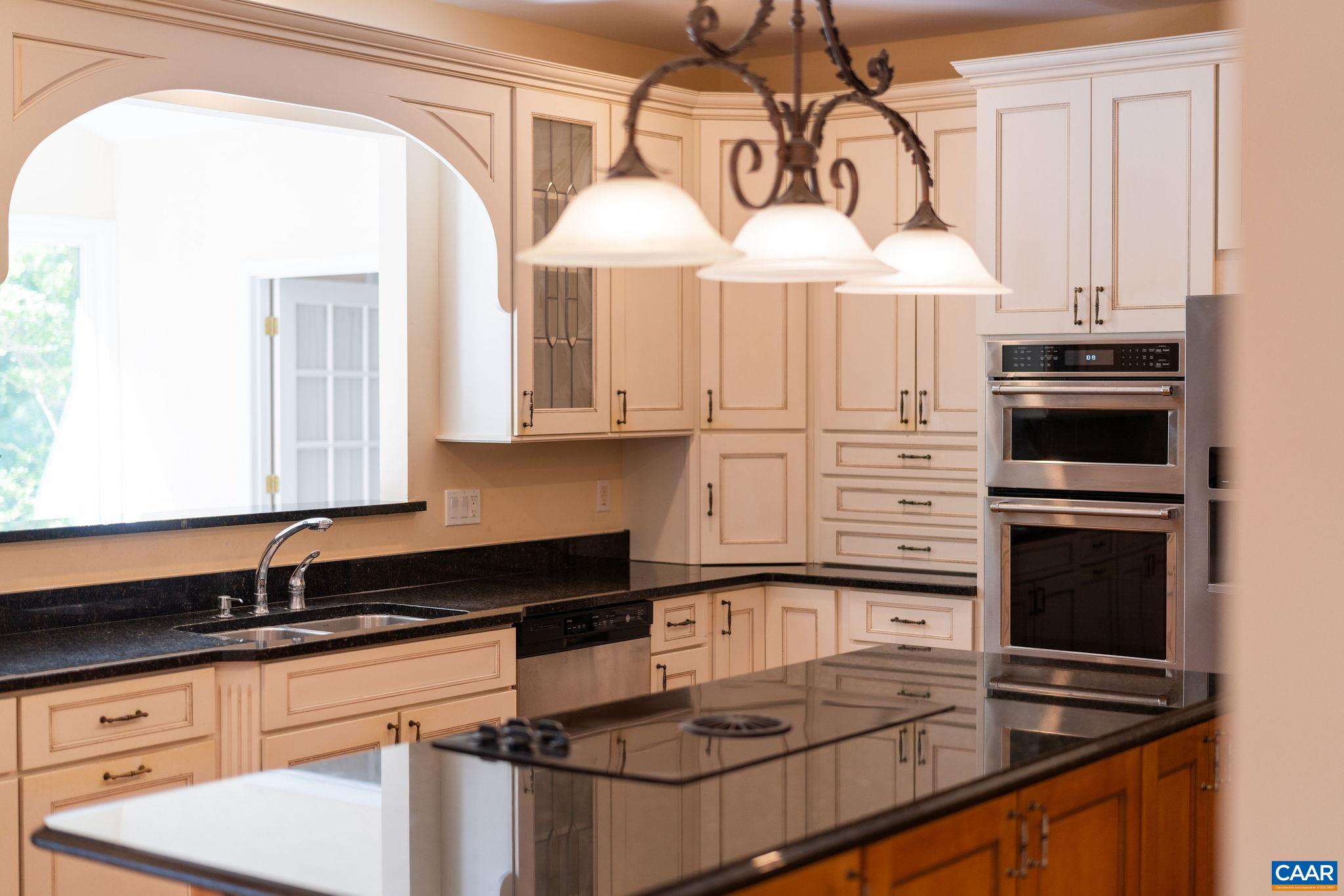 21 Amethyst Road Palmyra, VA 22963 - Photo 13 of 66 a kitchen with kitchen island granite countertop a sink cabinets and stainless steel appliances