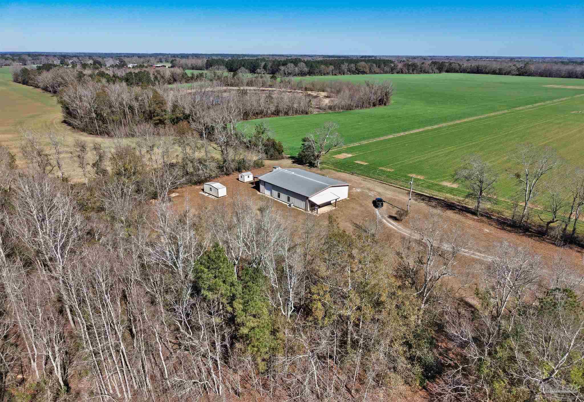 a view of a field with an outdoor space