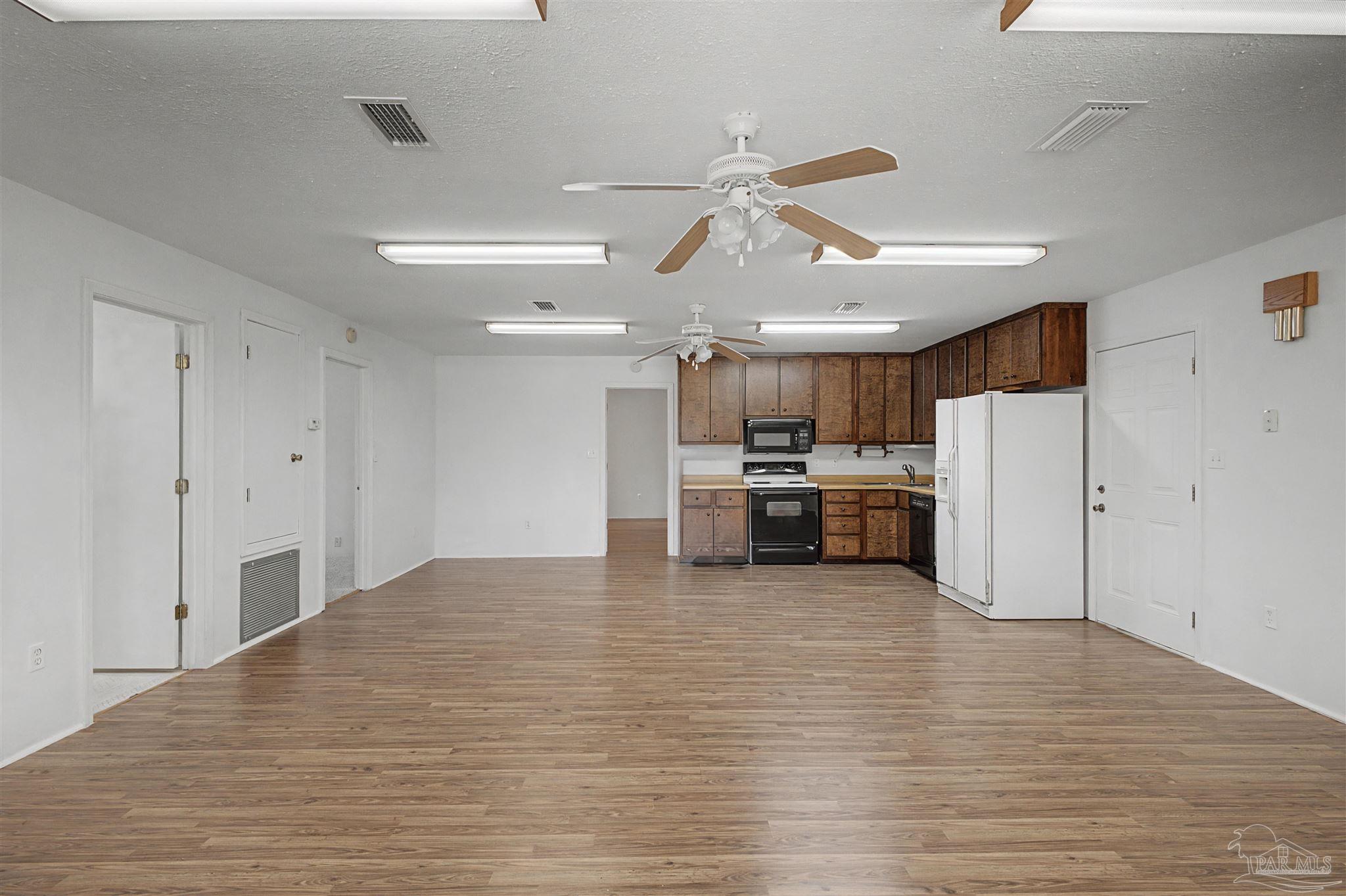 3401 Rocky Road Jay, FL 32565 - Photo 13 of 49 a view of kitchen with refrigerator and cabinets